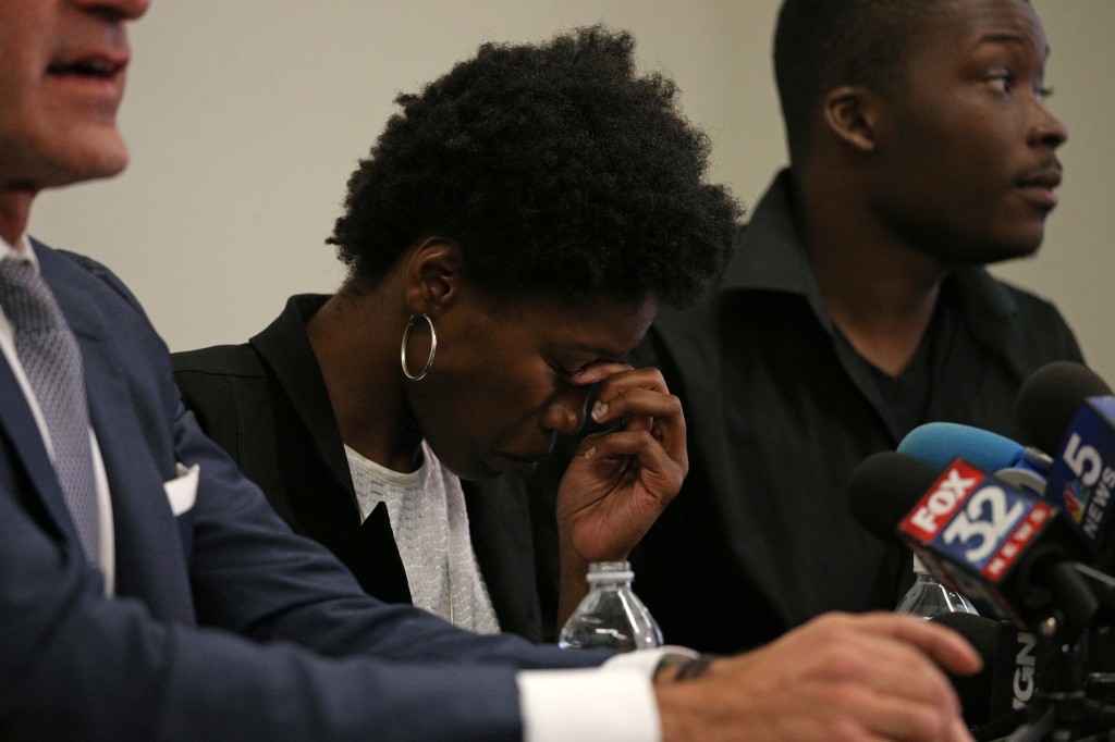 Shooting victim Paul O'Neal's sister Briana Adams 22 briefs the media at Michael Oppenheimer's left law office on Aug. 5 2016 in Chicago. The family viewed the Chicago police videos from the shooting death of Paul O'Neal early in the day at the IPRA