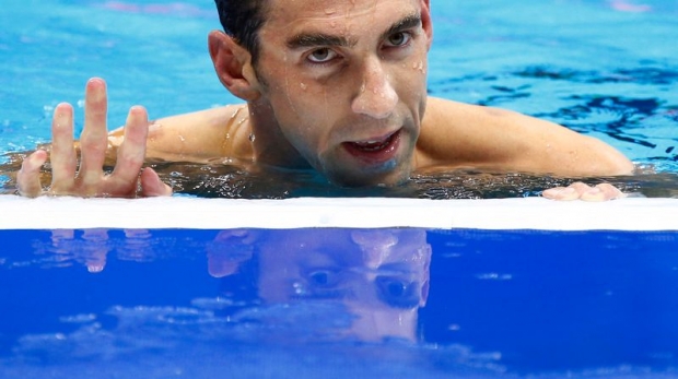 Michael Phelps reacts after winning the men's 200m individual medley final for his 22 Olympic gold medal at the Olympic Aquatics Stadium Rio de Janeiro