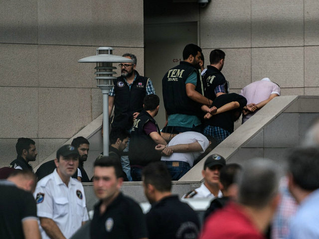 Detained Turkish soldiers who allegedly took part in a military coup arrive with their hands bound behind their backs at the Istanbul Justice Palace