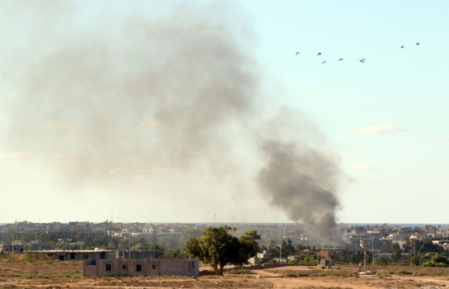 Smoke billows from buildings after the air force from the pro-government forces loyal to Libya's Government of National Unity fired rockets targeting I