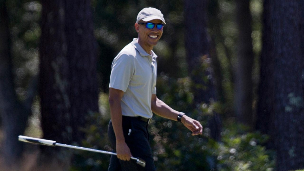 President Barack Obama smiles after putting on the first green during a round of golf at Farm Neck Golf Course in Oak Bluffs Mass. on Marthas Vineyard Sunday Aug. 7 2016