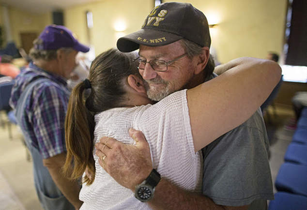 Charles Craft 57 right gets a hug from Tammie Lovelady 49 before church service at South Walker Baptist Church in Walker La. Sunday Aug. 21 2016. Cr