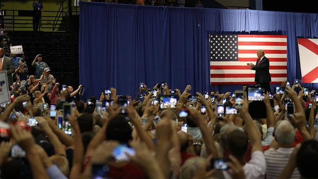 Republican presidential nominee Donald Trump arrives on stage for his campaign event at the Ocean Center Convention Center