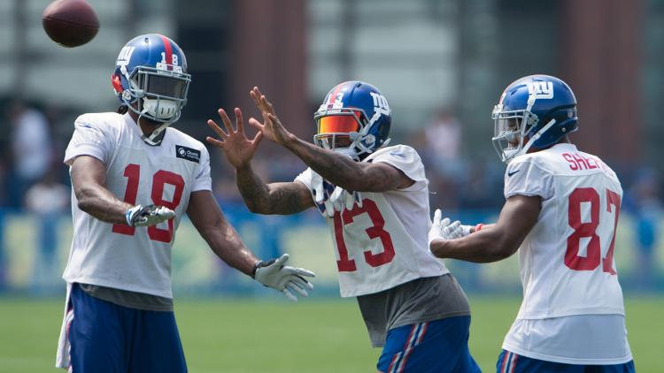 Odell Beckham catches the ball between fellow Giants wide receivers Sterling Shepard and Geremy Davis Saturday