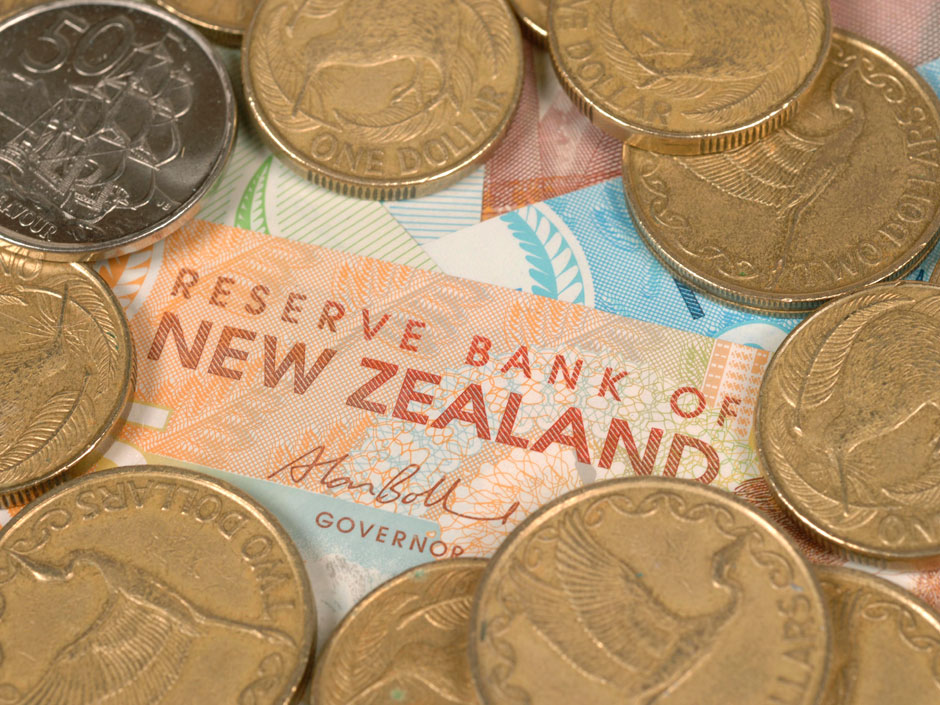 New Zealand's dollar surged to a one-year high after the country's central bank cut interest rates and signaled a more gradual easing path than some investors had anticipated