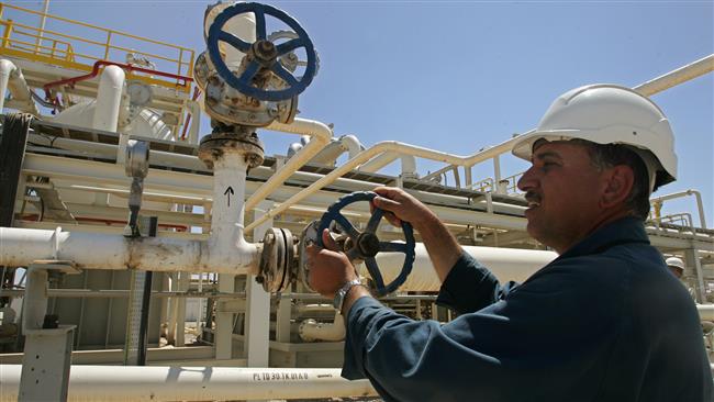 An employee works at the Tawke oil field near the town of Zacho