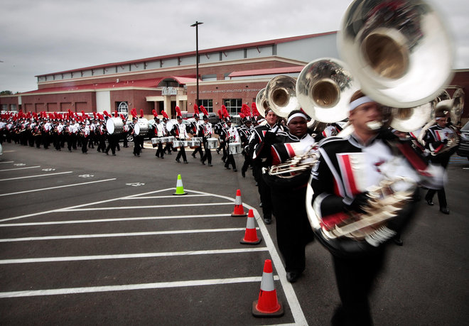 The Ole Miss marching band will not be playing Dixie this year at games in an effort to move on and create new traditions according to the university's Athletic Department. Band members are seen in a 2014