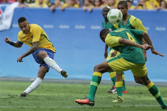 Brazil's Neymar left strikes the ball during a group A match of the men's Olympic football tournament between Brazil and South Africa at the National stadium in Brasilia Brazil Thursday Aug. 4 2016