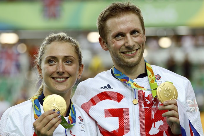 Laura Trott left and her fiance Jason Kenny right both of Britain pose with their gold medals at the Rio Olympic Velodrome during the 2016 Summer Olympics in Rio de Janeiro Brazil Tuesday Aug. 16