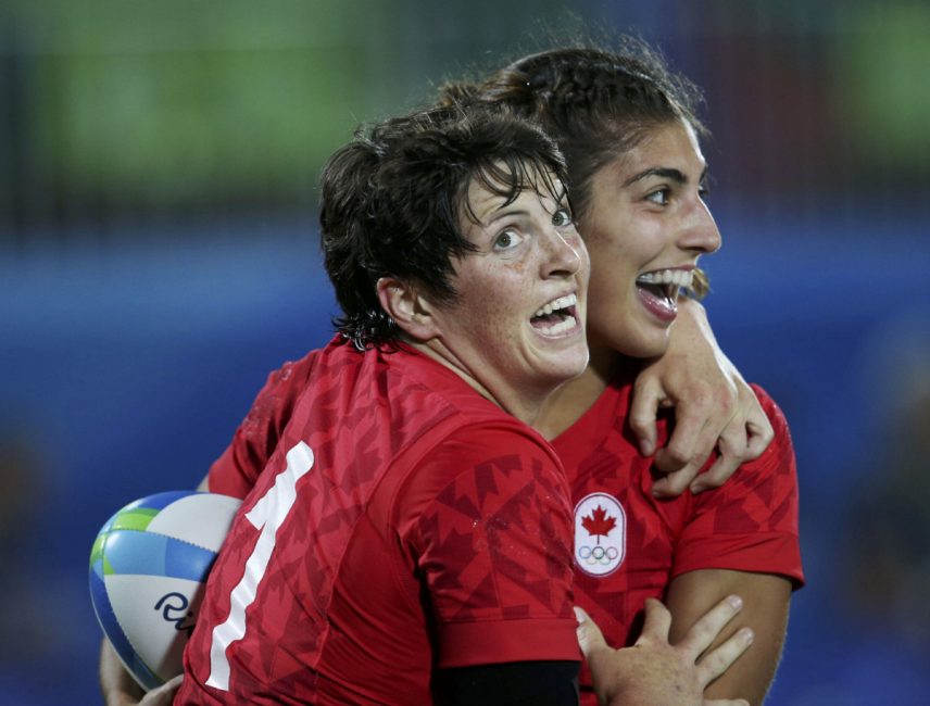 Bianca Farella celebrates with Britt Benn after scoring a try in the women's quarter-finals