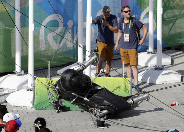 ADDS THAT MULTIPLE PEOPLE WERE INJURED- An overhead camera that fell from wires suspending it over Olympic Park lays on the ground at the Summer Games in Ri