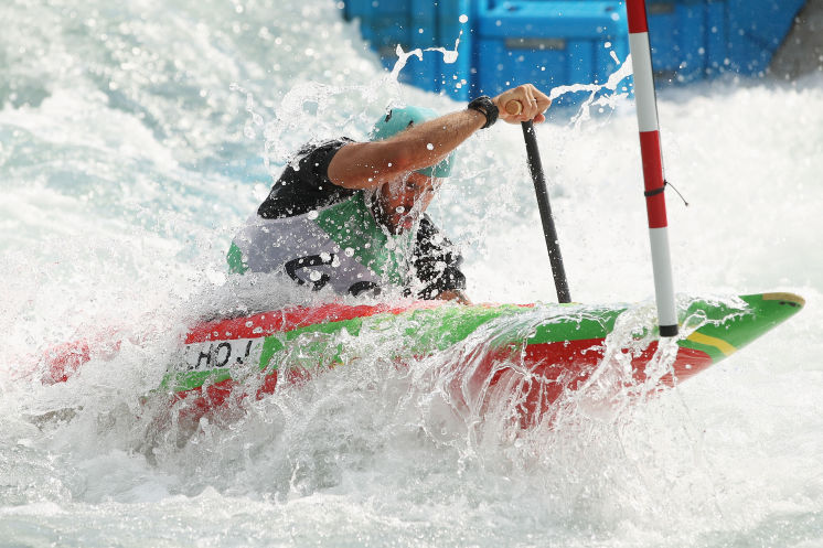 RIO DE JANEIRO BRAZIL- AUGUST 02 Single C1 canoe slalom competitor Lucas Carvalho of Mexico practises at the Olympic Whitewater Stadium