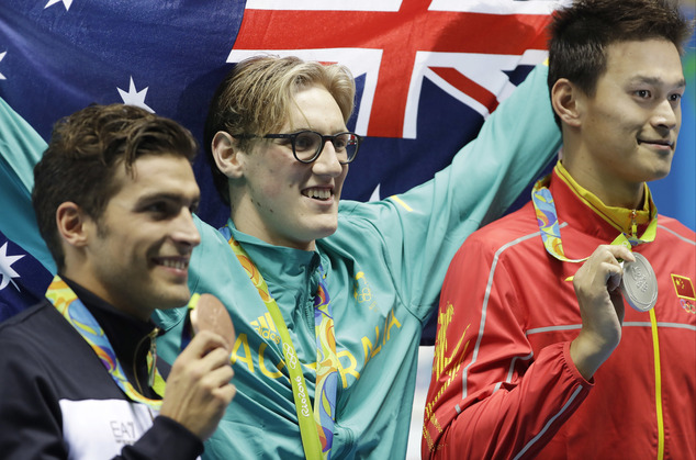 Winner Australia's Mack Horton center second placed Italy's Gabriele Detti left and third placed China's Sun Yang hold their medals after the men's 400-m