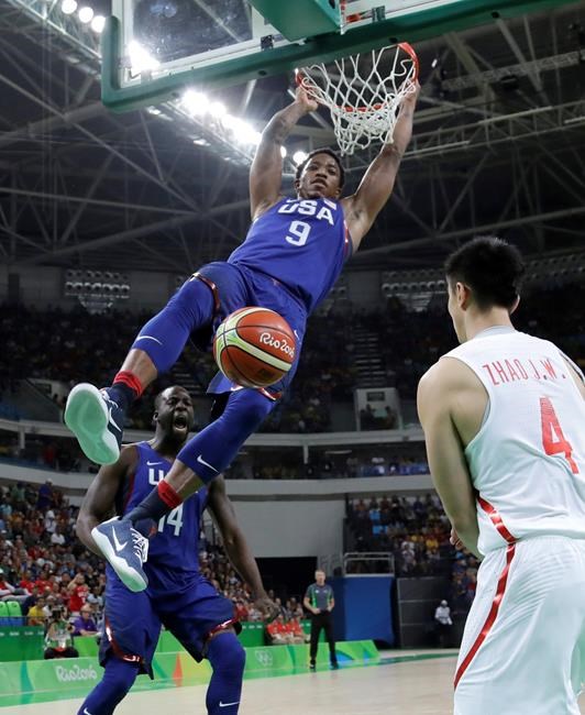 United States&#39 De Mar DeRozan scores over China's Zhao Jiwei during a men's basketball game at the 2016 Summer Olympics in Rio de Janeiro Brazil Saturday Aug. 6 2016