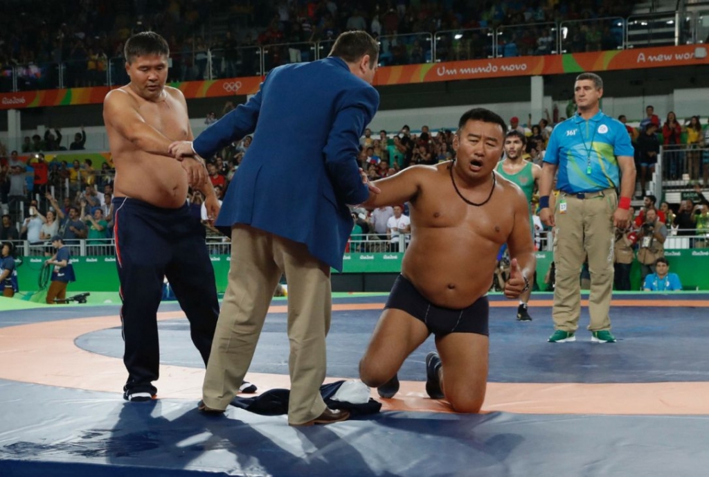 Mongolian wrestling coaches stripped on the mat to protest the outcome of a bronze-medal match between Mandakhnaran Ganzorig and Uzbekistan's Ikhtiyor Navruzov