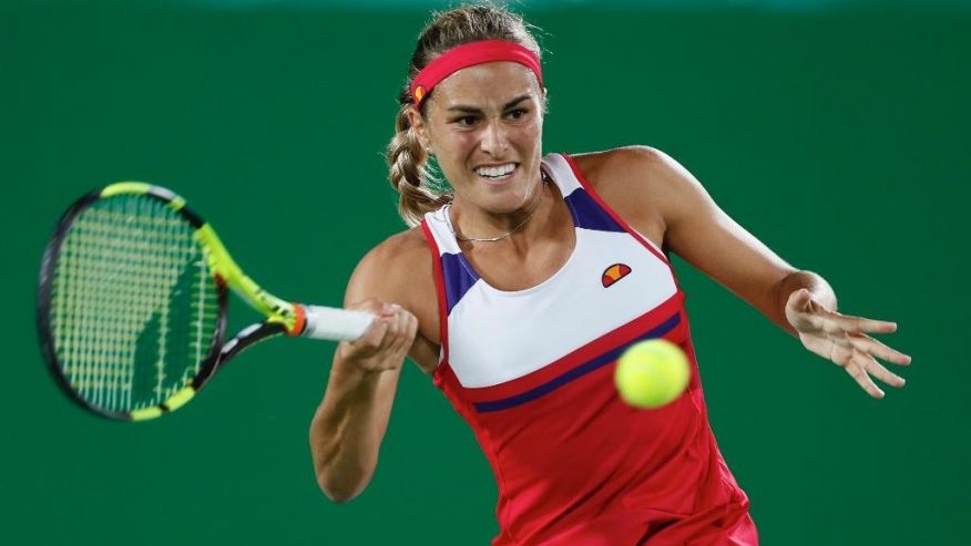 Monica Puig of Puerto Rico returns to Germany's Angelique Kerber in the gold medal match of the women's tennis competition at the 2016 Summer Olympics in Rio de Janeiro Brazil Saturday Aug. 13 2016