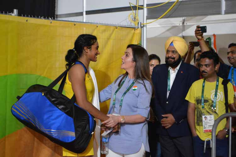 India/'s P.V. Sindhu who thumped Nozomi Okuhara of Japan to enter the final of the women/'s singles event of badminton competitions at the Rio 2016 Olympic Games with IOC member Nita Ambani in Rio de Janeiro Brazil on Aug 18 2016