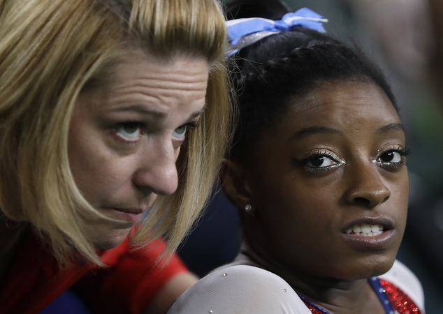 United States Simone Biles speaks with her coach Aimee Boorman during the artistic gymnastics women's individual all-around final at the 2016 Summer Olympic