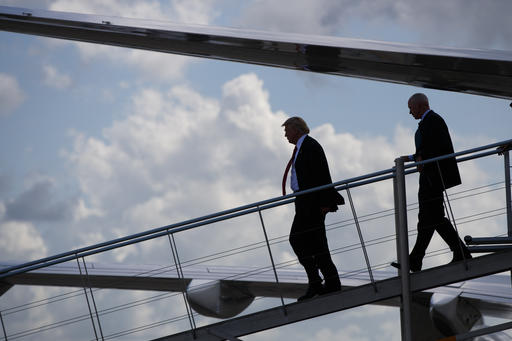 Republican presidential candidate Donald Trump steps off his plane after arriving for a campaign rally at Crown Arena Tuesday Aug. 9 2016 in Fayetteville N.C