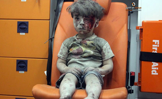 Syria conflict: Image of injured boy in Aleppo draws outrage