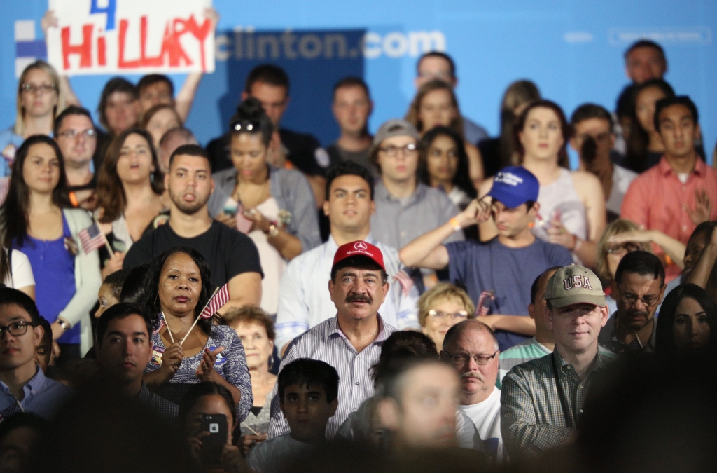 A man identified as Seddique Mateen, whose son shot and killed 49 people and injured 53 others inside the Pulse nightclub in June sits with supporters at a rally for Democratic Presidential nominee Hillary Clinton at the Osceola Heritage