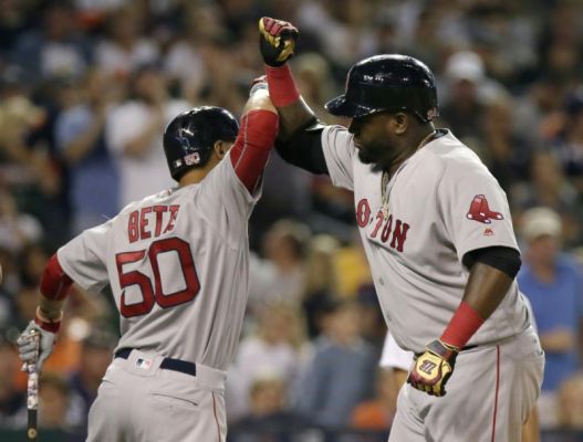 Boston Red Sox's David Ortiz celebrates with Mookie