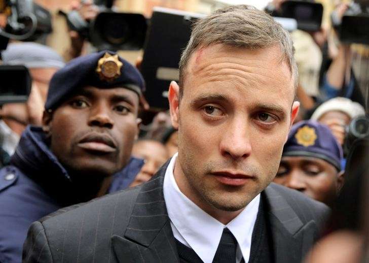 Olympic and Paralympic track star Oscar Pistorius leaves court after appearing for the 2013 killing of his girlfriend Reeva Steenkamp in the North Gauteng High Court in Pretoria South Africa