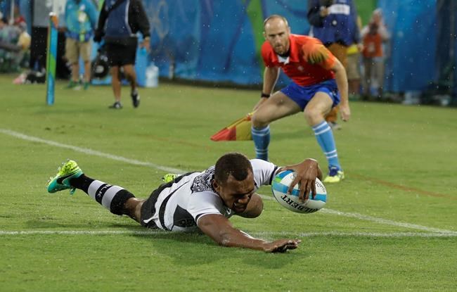 Fiji's Osea Kolinisau scores a try during the men's rugby sevens match against New Zealand at the Summer Olympics in Rio de Janeiro Brazil Wednesday Aug. 10 2016