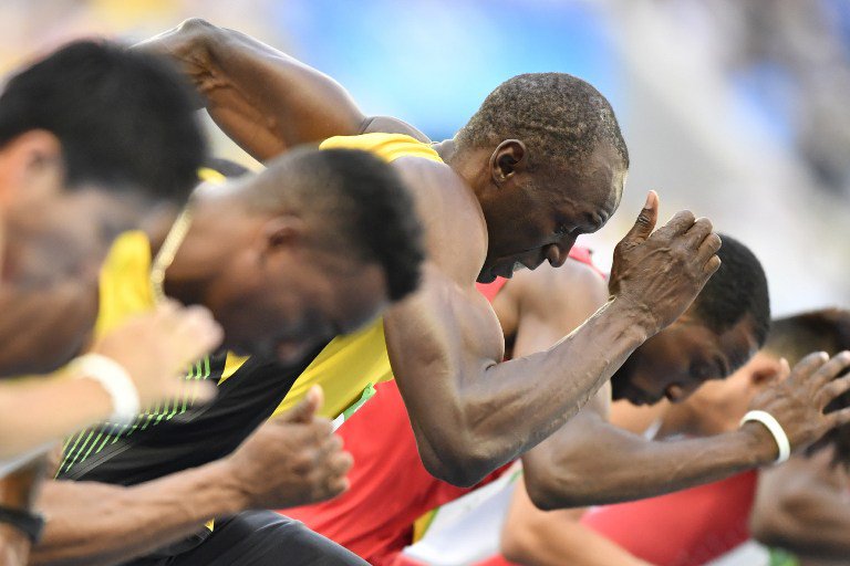 Jamaica's Usain Bolt competes in the Men's 100m Round 1 during the athletics event at the Rio 2016 Olympic Games at the Olympic Stadium in Rio de Janeiro