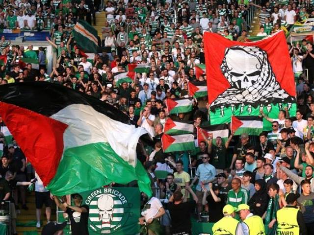 Scottish football club fans wave Palestinian flags during intl. match with Israeli team