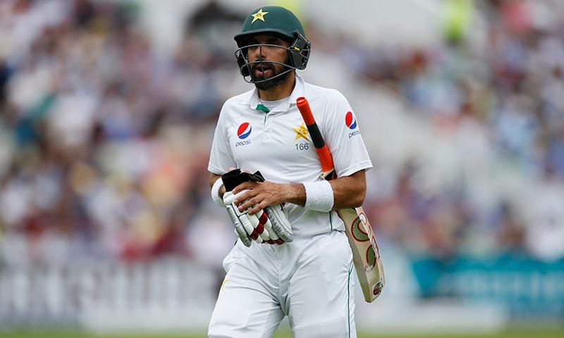 Pakistan's Misbah-ul Haq walks off after being bowled by England's James Anderson. — Reuters