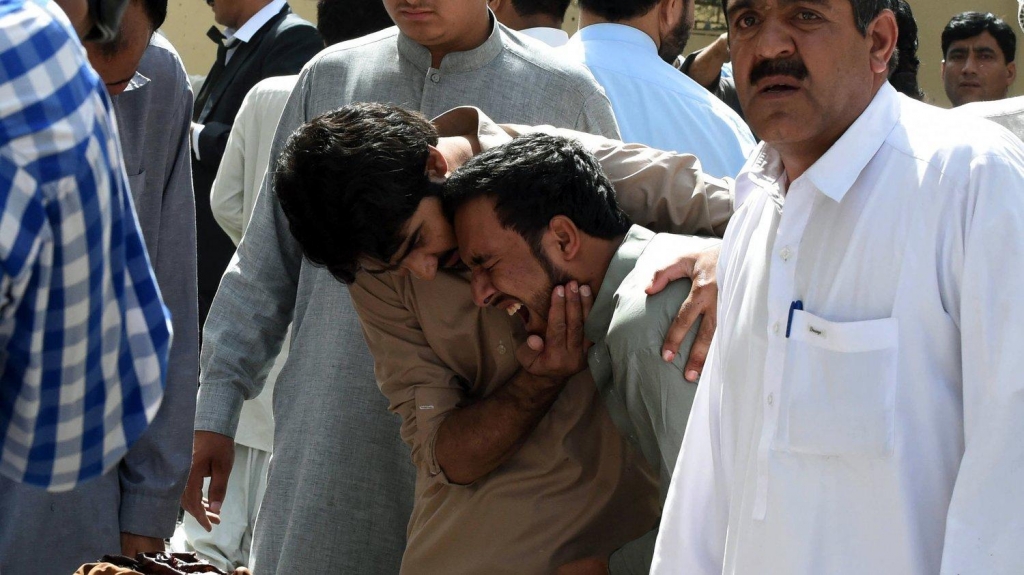 Pakistani journalists react over the body of a news cameraman after an explosion at a government hospital in Quetta on Monday. Banaras Khan  AFP  Getty Images