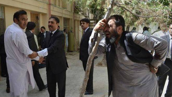 Pakistani lawyers mourn the deaths of their colleagues following a bomb blast in Quetta Pakistan Monday