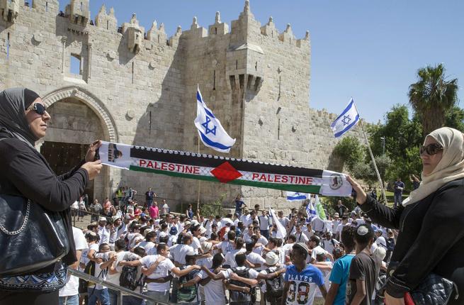 Palestinians and Israelis outside Damascus Gate in Jerusalem's Old City