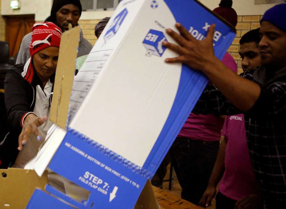 Election officials start the ballot counting process at a polling station during municipal elections in Manenberg on the outskirts of Cape Town South Africa Wednesday Aug. 3 2016. South Africans voted Wednesday in municipal elections described as the