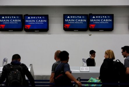 Passengers check in at a counter of Delta Air Lines in Mexico City Mexico