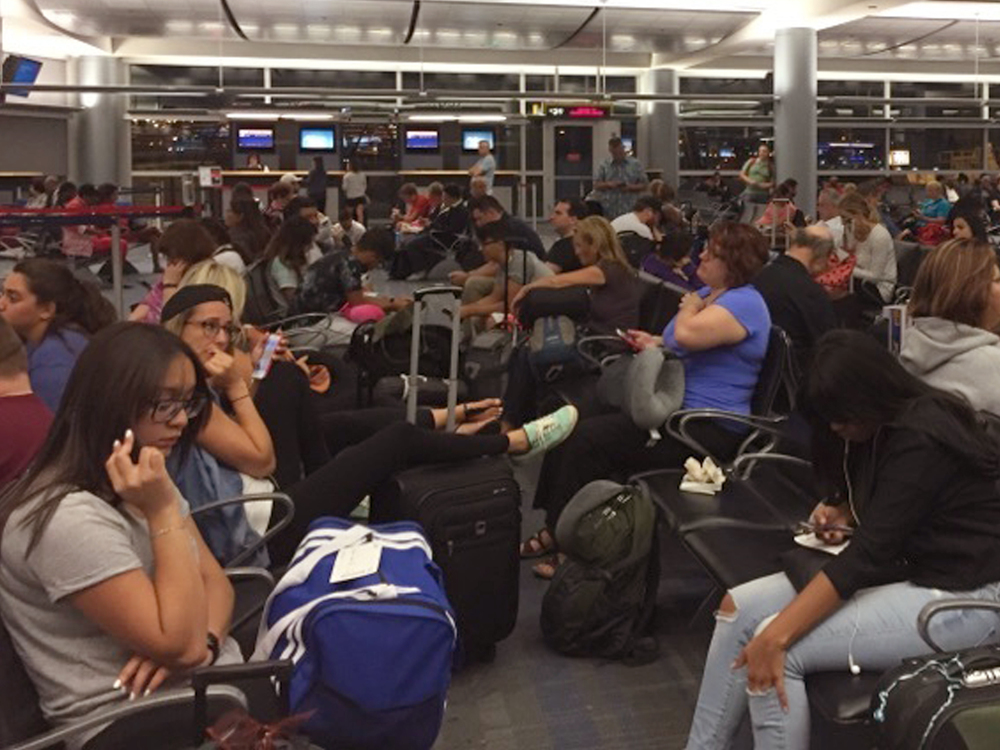 Passengers packed the boarding area at Mc Carran International Airport in Las Vegas following Monday's Delta outage