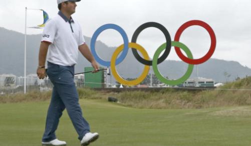 Patrick Reed of the United States walks down the fairway during a practice session