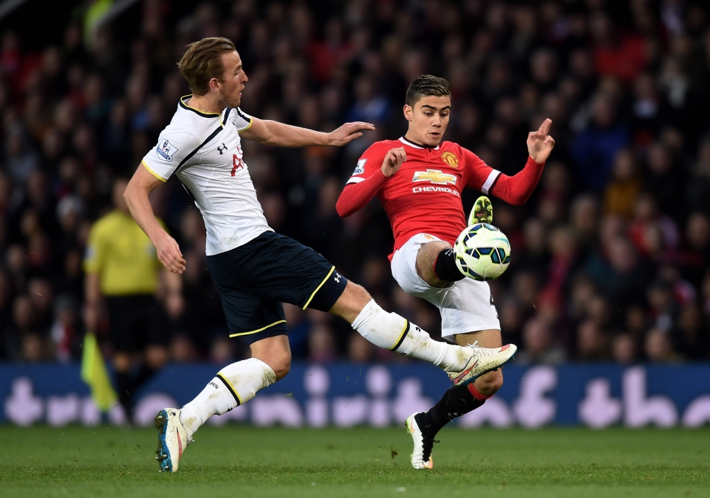 MANCHESTER ENGLAND- MARCH 15 Harry Kane of Spurs and Andreas Pereira of Manchester United compete for the ball during the Barclays Premier League match between Manchester United and Tottenham Hotspur at Old Trafford