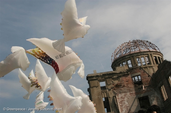 Peace doves fly on the eve of the 60th Anniversary of the Hiroshima Atomic Bombing in 2005. The message of peace reads'No More Hiroshima