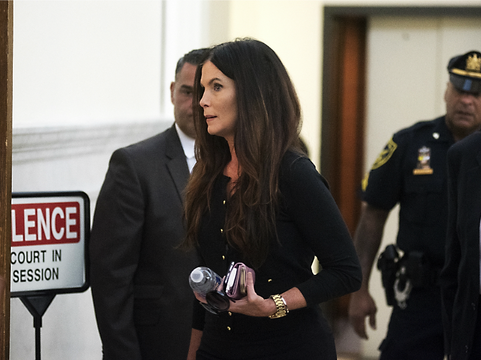 Ellen Granahan Goffer twin sister of Pennsylvania Attorney General Kathleen Kane walks into the courtroom on the opening day of Kane's trial at the Montgomery County Courthouse Monday Aug. 8 2016