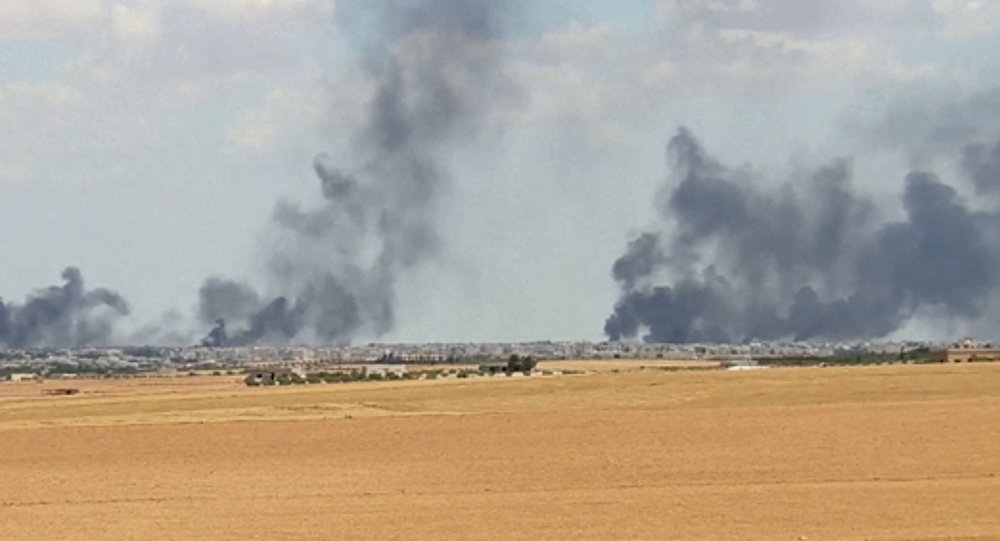 A video grab shows smoke rising from the city of Manbij Syria