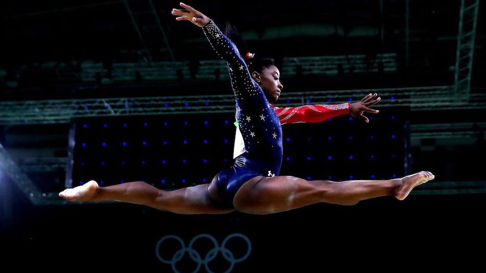 Simone Biles of the United States competes on the balance beam during Women's qualification for Artistic Gymnastics on Day 2 of the Rio 2016 Olympic Games at the Rio Olympic Arena