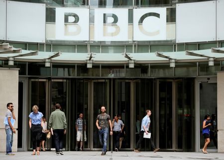 People arrive and depart from Broadcasting House the headquarters of the BBC in London