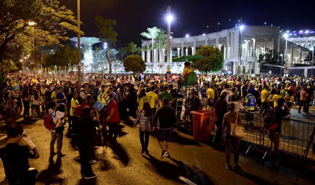 People head to the stadium before the start of the opening ceremony of the Rio 2016 Olympic Games on Friday