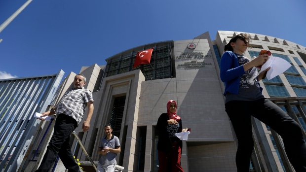 People leave from a courthouse in Istanbul on Monday Aug. 15 2016