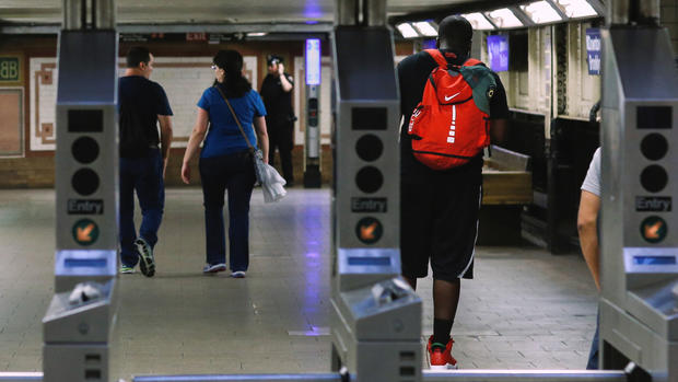 People pass through a subway terminal in New York