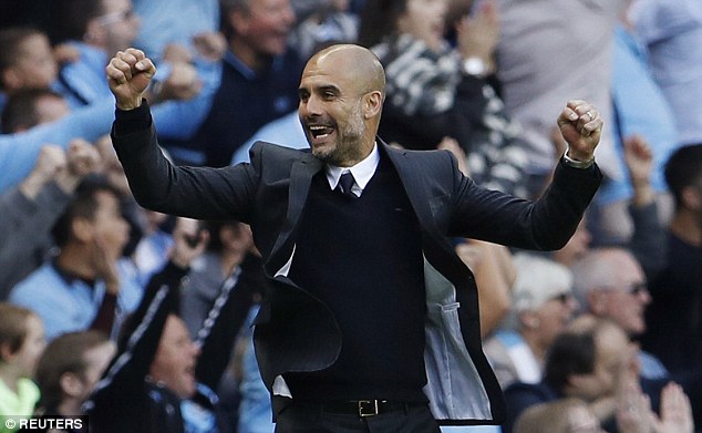 Pep Guardiola celebrates after leading Manchester City to a victory over Sunderland