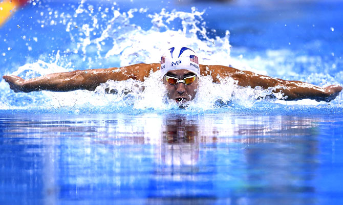 USA's Michael Phelps competes in a Men's 100m Butterfly heat during the swimming event at the Rio 2016 Olympic Games at the Olympic Aquatics Stadium in Rio de Janeiro. Pic  AFP