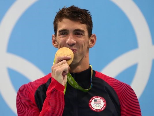 Phelps with his gold medal after the men's 200m individual medley final